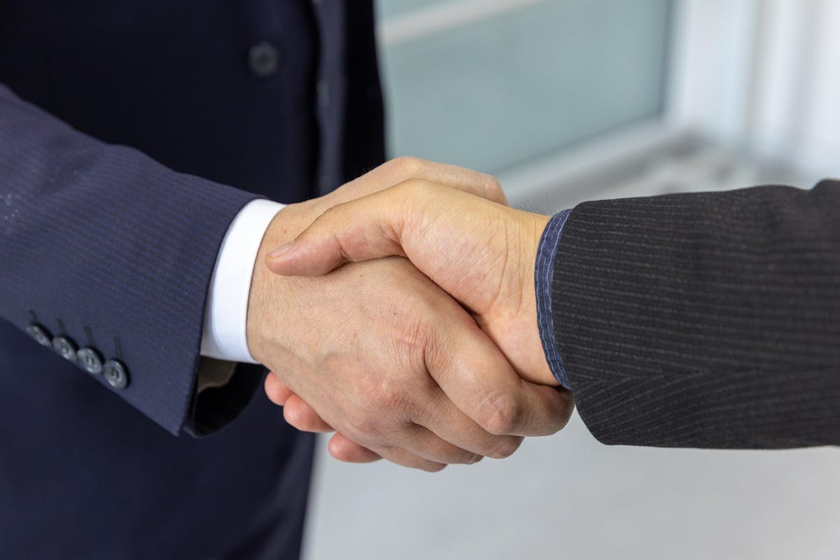 Closing handshake deal agreement business