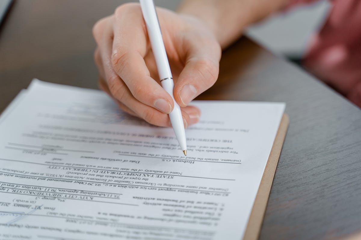 Signing agreement pen closeup