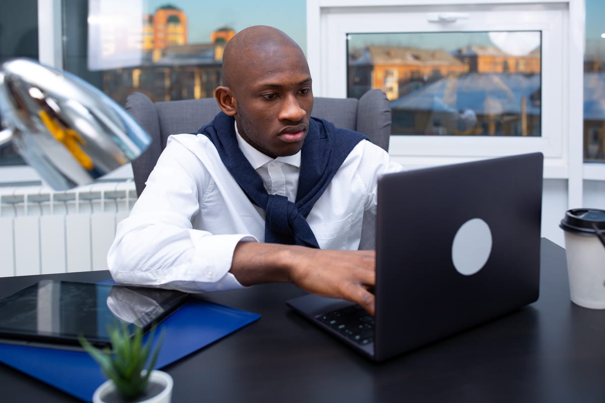 Man working laptop office focused