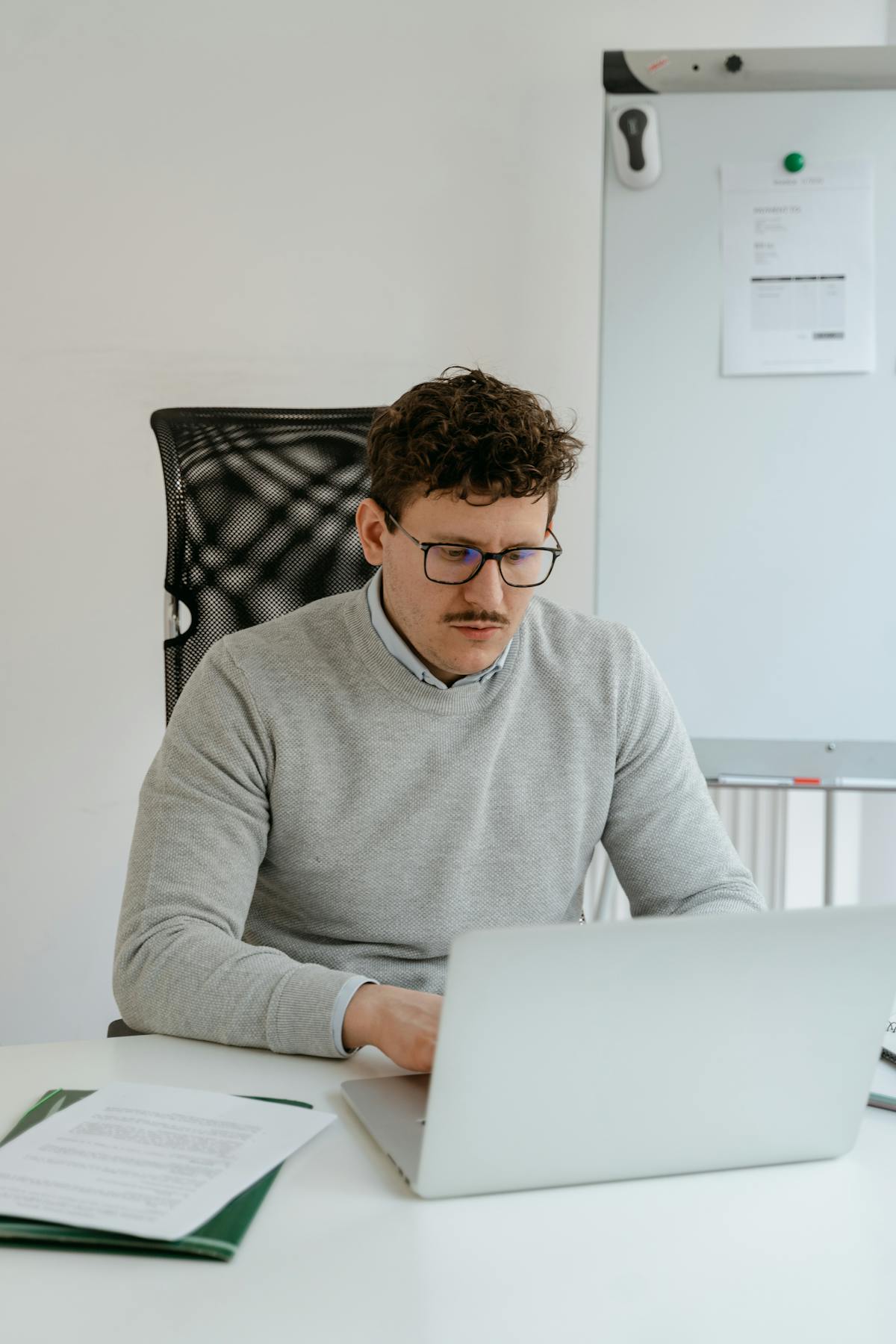 Man working laptop office focused